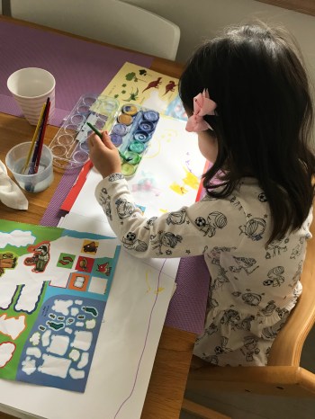 Toddler play time stickers and painting